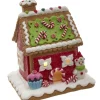 Maison en pain d'épices avec bonhomme de neige.