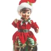 Pièce de table, elfe en rouge, assis sur le cadeau de Noël