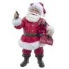 Pièce de table représentant le Père Noël Coca-Cola® tenant deux packs de six