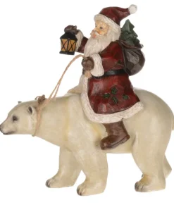 Père Noël chevauchant un ours polaire